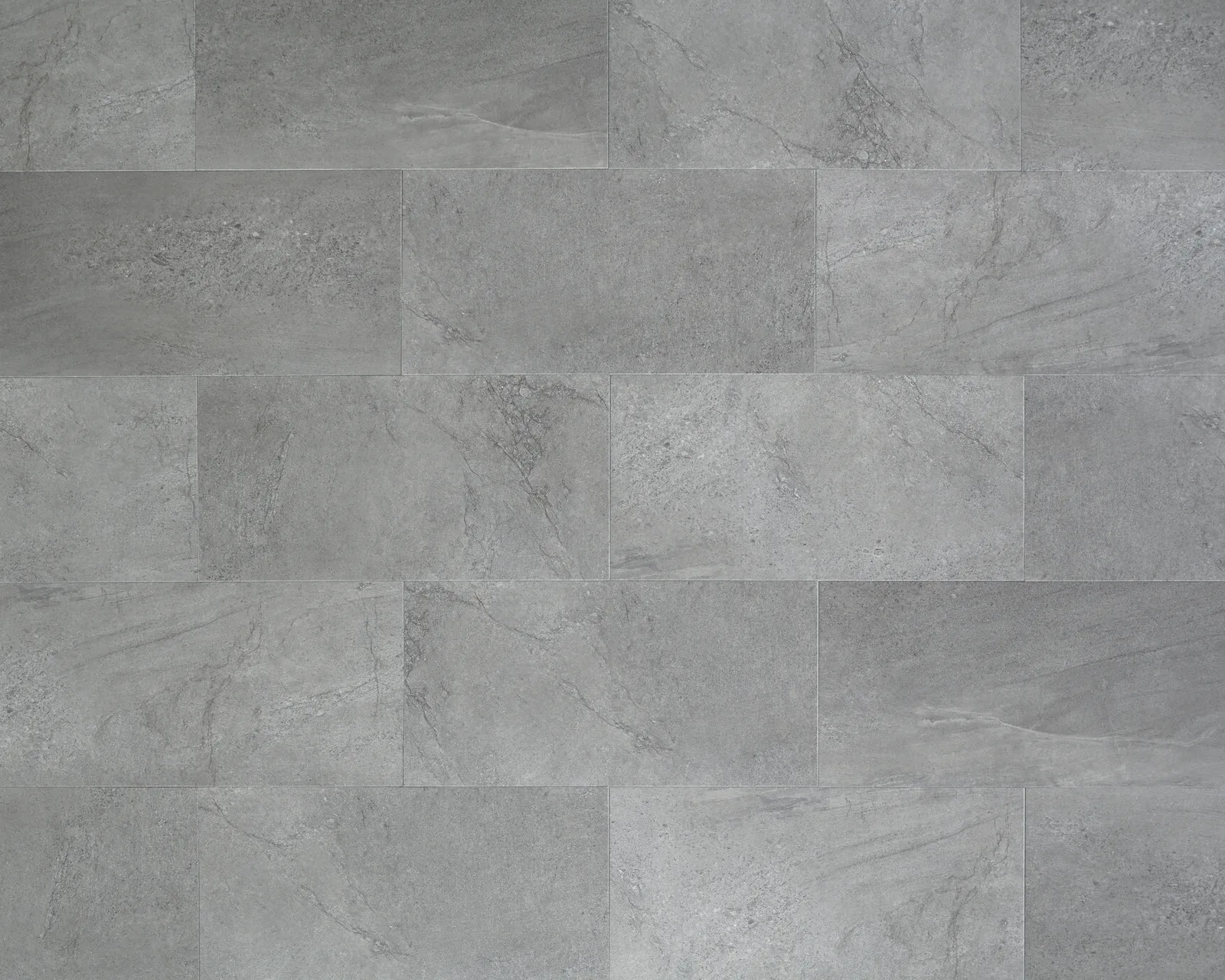 Meridian Luxury Vinyl Plank Flooring in Stucco, Carbon, and Steel colors, sizes 12" x 24", made of durable luxury vinyl