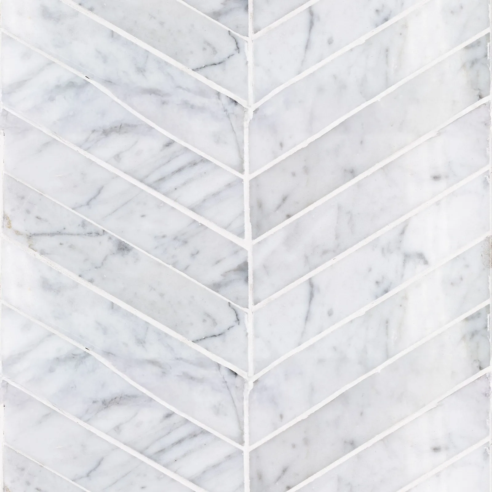 Sto-re Chevron porcelain tile in Carrara, Ocean White, and Volakas colors, polished finish, available in sizes 5/8X3 and 1-1/2X9