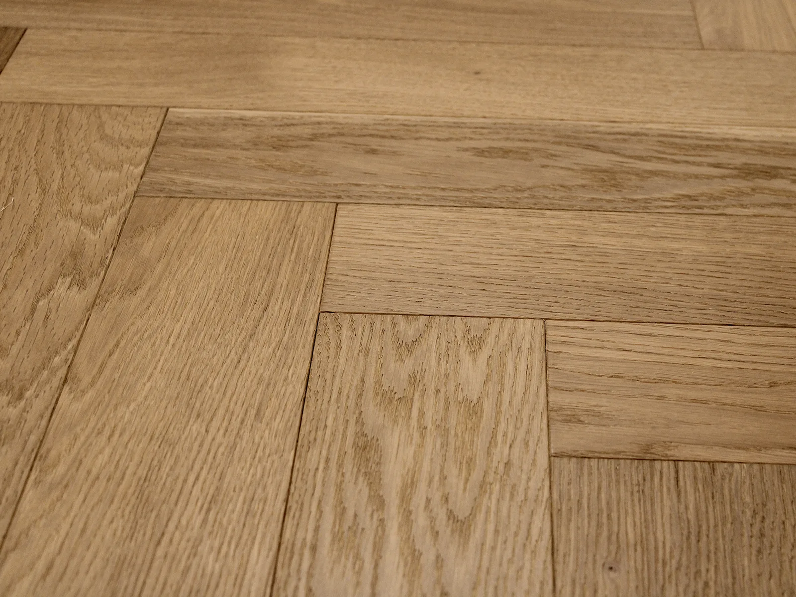 Venelle Herringbone engineered hardwood flooring in rustic grade with wire-brushed finish, 1/2" x 4-3/4", European Oak material
