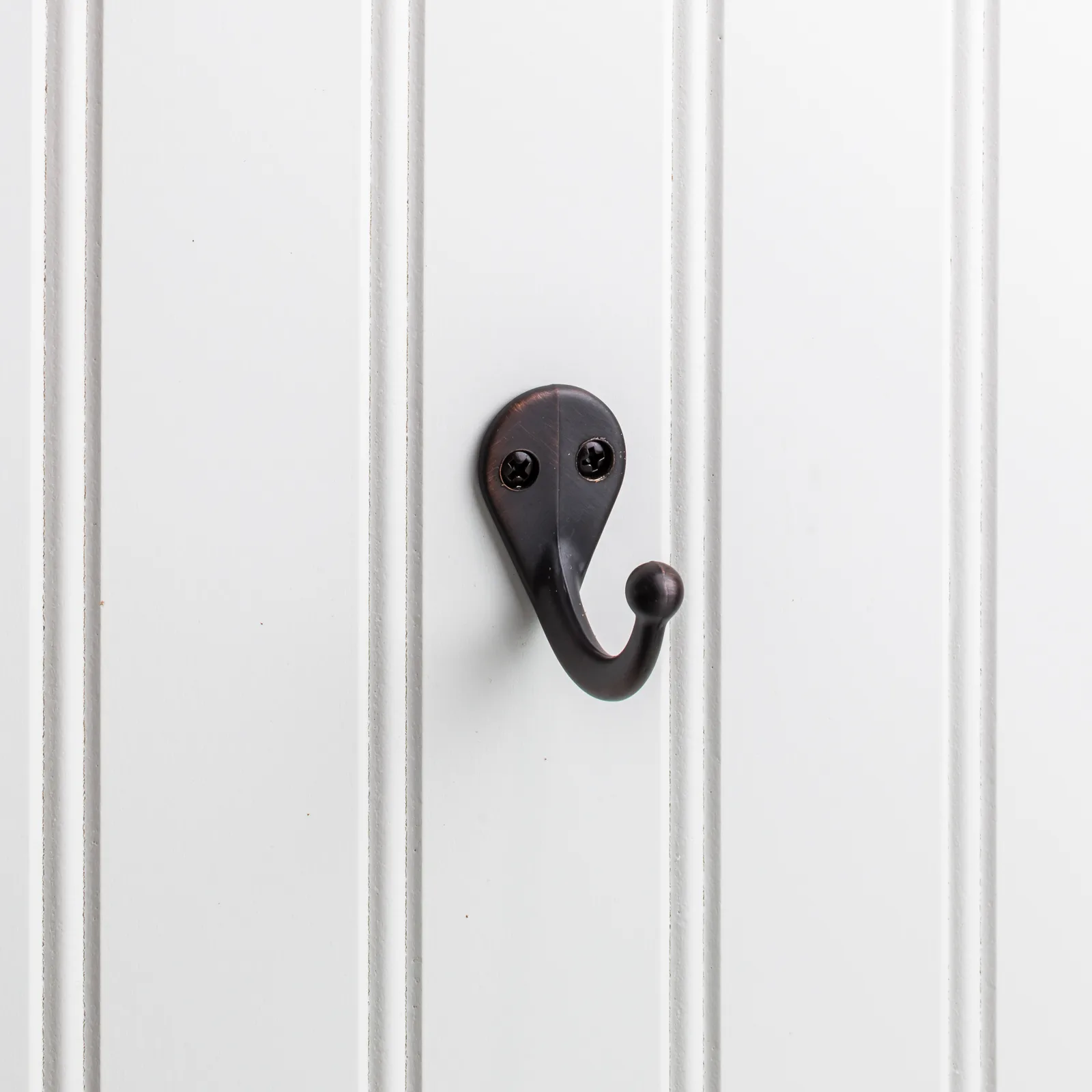 1-3/4" Single zinc wall mount hook. Finish: DBAC.
