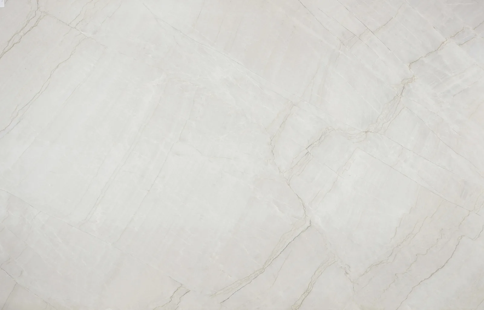 Azzurra Bay quartzite countertop in polished finish, featuring a cool white color with blue undertones and subtle veining, available in 2CM and 3CM thickness.