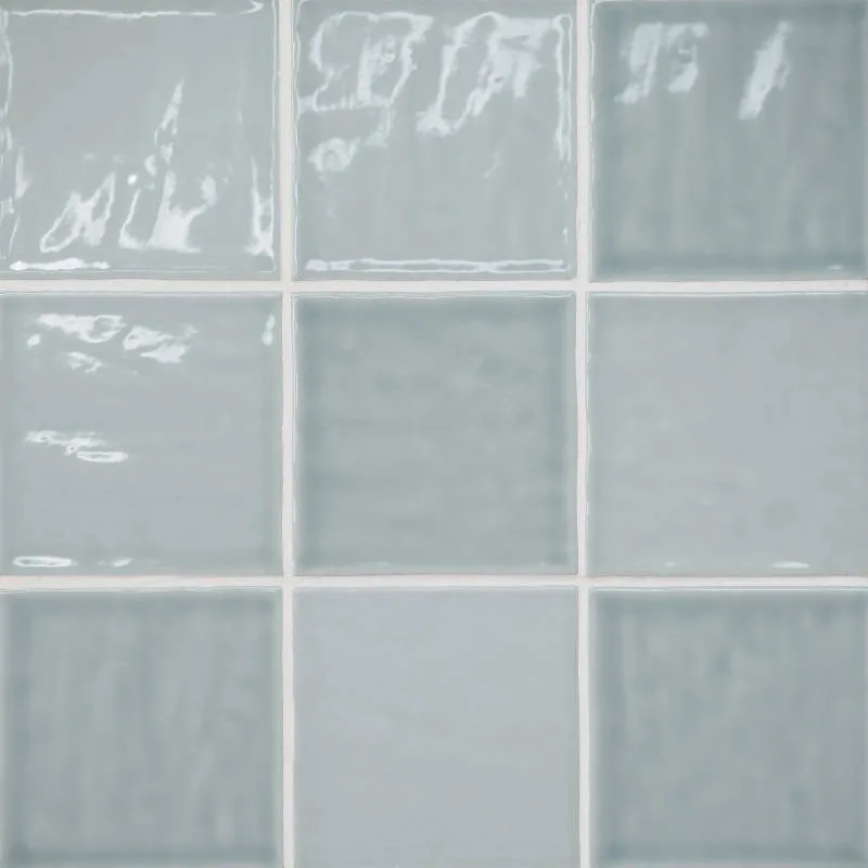 Misty Blue ceramic wall tile in gloss finish, available in sizes 4x4, 2.5x5, and 2.5x10, perfect for backsplashes and shower walls.