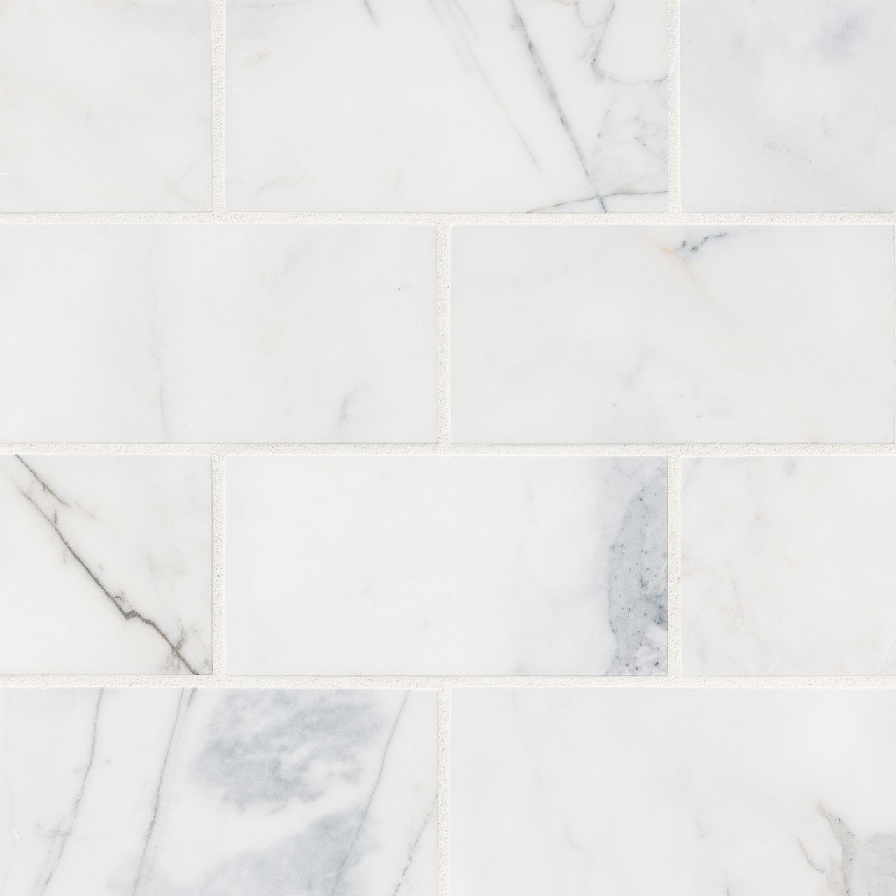Calacatta Cressa Marble Subway Tile in white-cool finish, honed texture, available in sizes 4x12 and 3x6, natural stone material.
