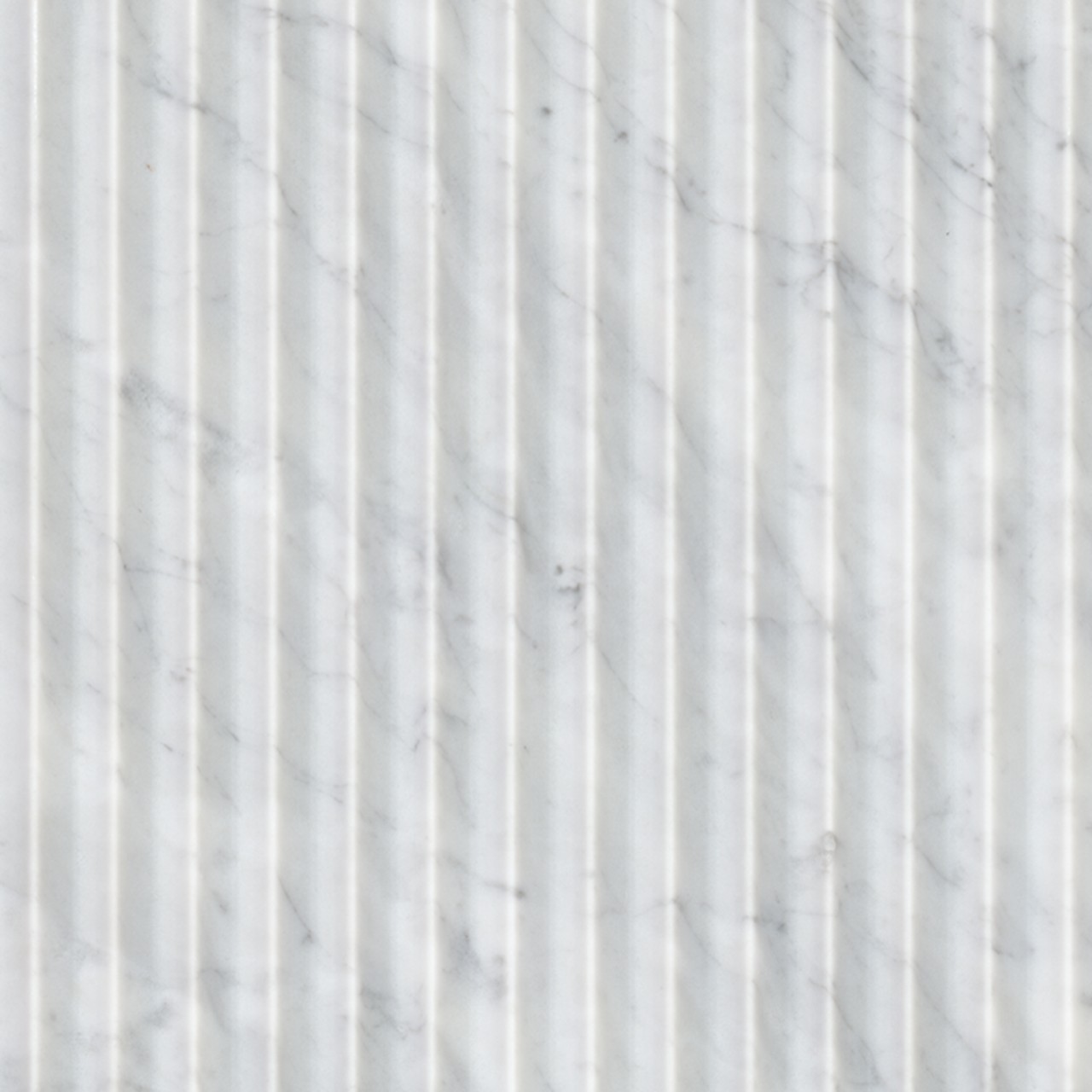 Carrara White Valentino Fluto 12x24 Honed tile in cool white with gray hues, fluted texture, perfect for modern interiors